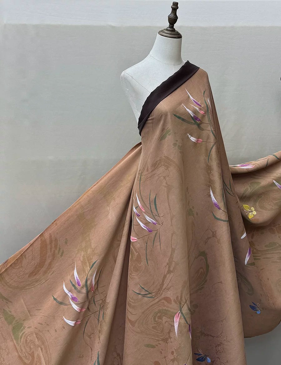 A mannequin wearing a brown fabric with a floral pattern, displayed against a plain background.