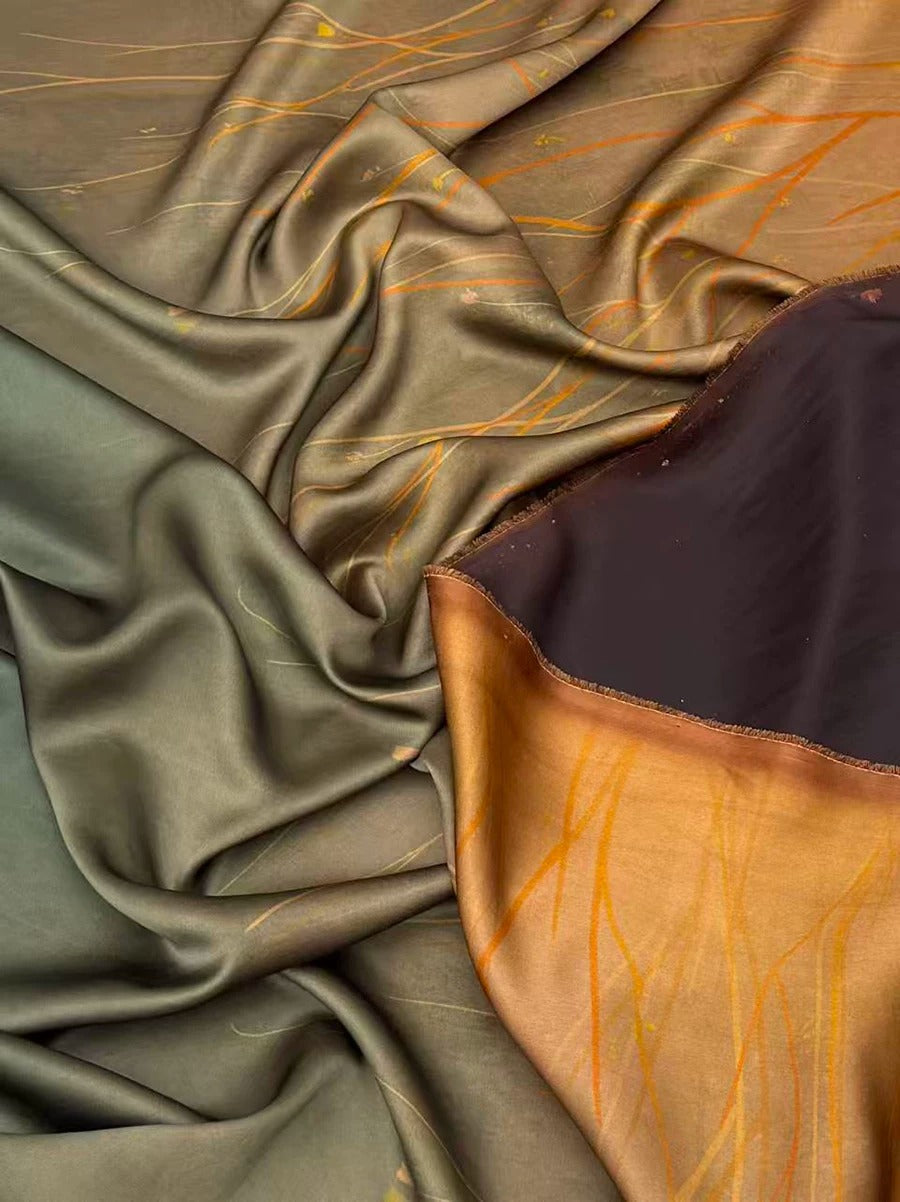 The image is a close-up of a fabric with a mix of green and brown colors, featuring a crumpled texture.