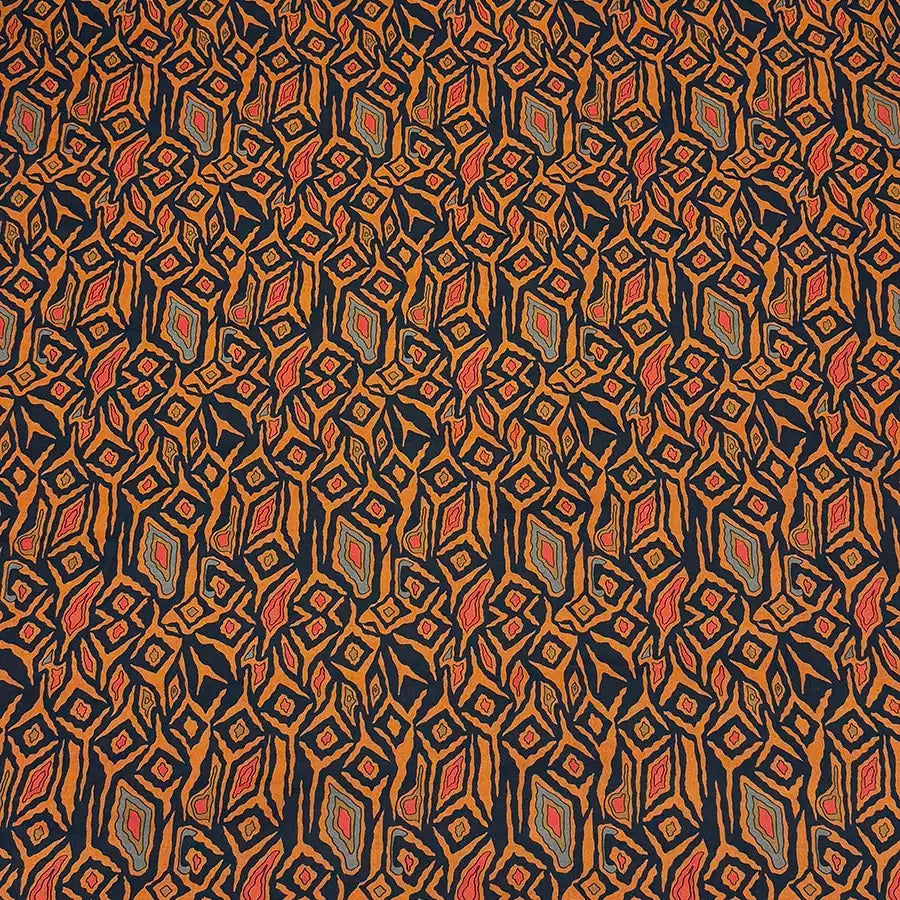 a repeating pattern of diamond shapes in various shades of orange, black, and red.