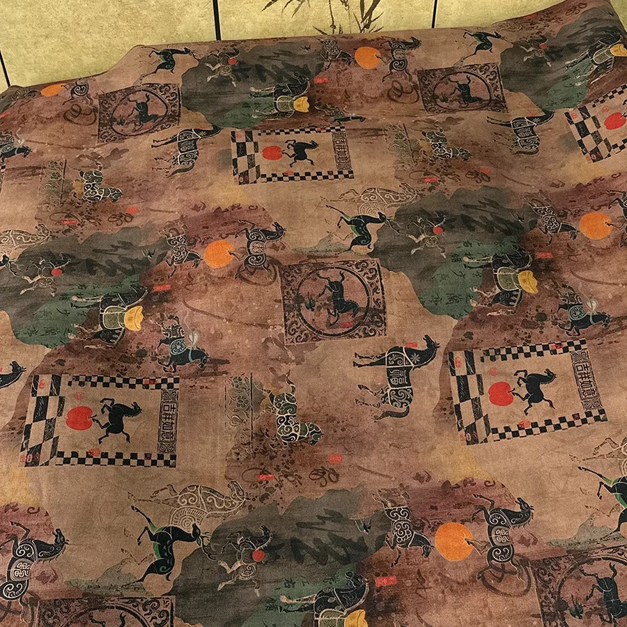 a patterned fabric with various animal and geometric designs, including horses, elephants, and geometric shapes.