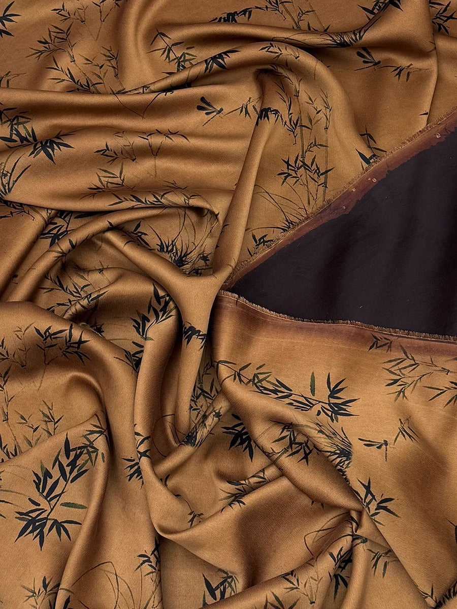 a close-up view of a fabric with a brown and black leaf pattern, creating a textured and visually interesting surface.