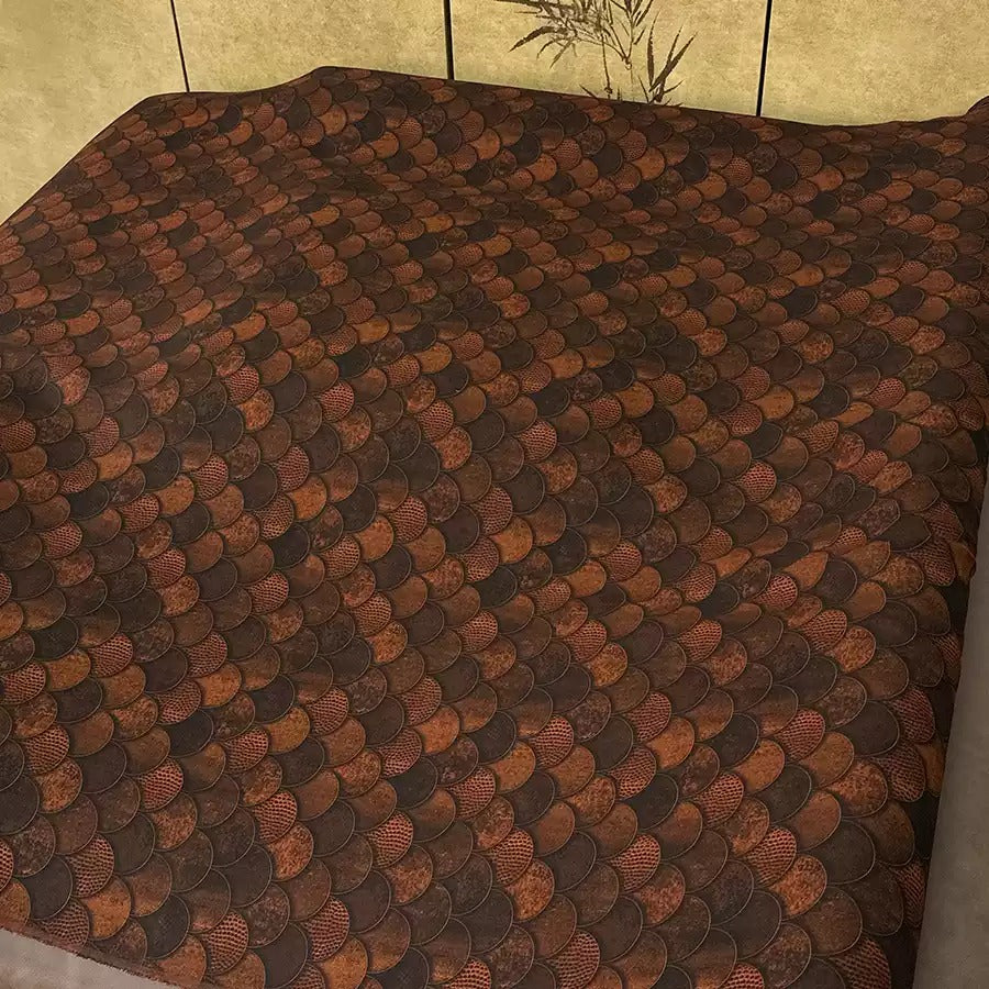 a bed with a brown and orange patterned bedspread or comforter.