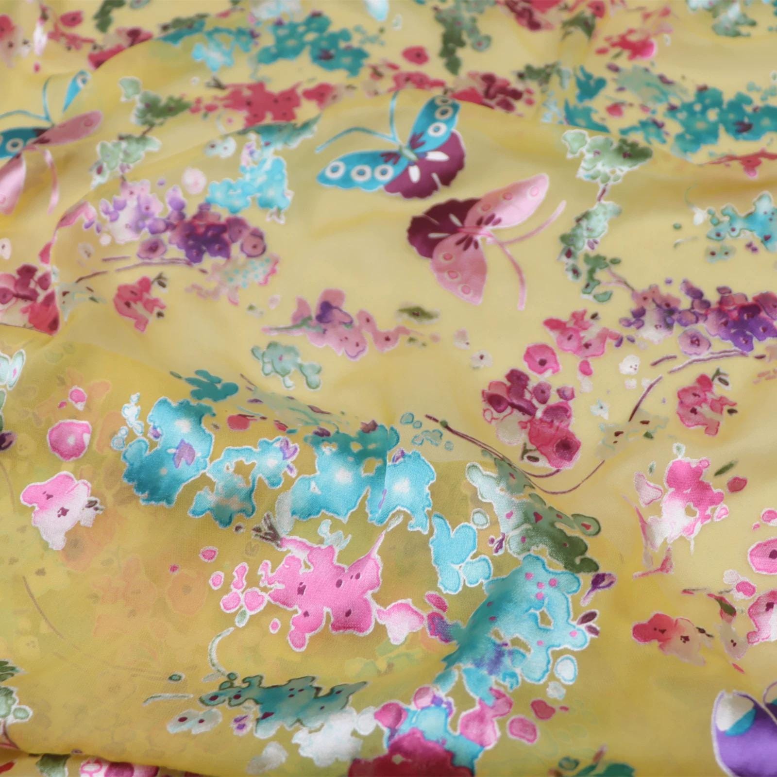 The image is a close-up of a fabric with a vibrant floral pattern, featuring a variety of colorful flowers and butterflies.