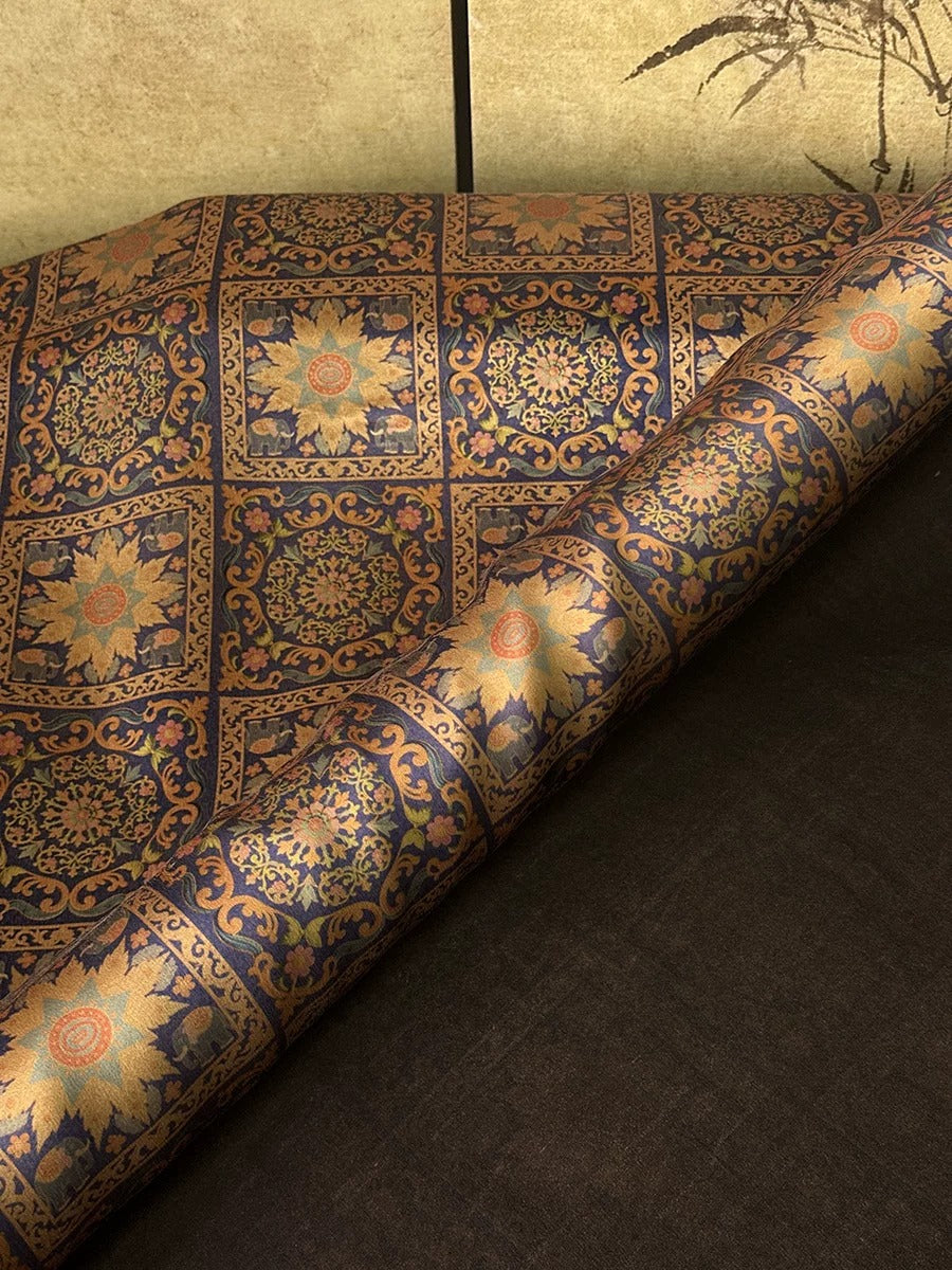 a close-up view of a decorative fabric with a floral pattern, showcasing intricate designs and vibrant colors.