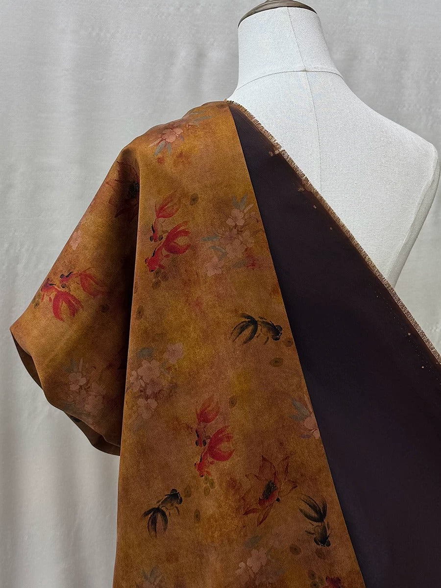 a mannequin wearing a dress with a floral print on the left side and a dark fabric on the right side.