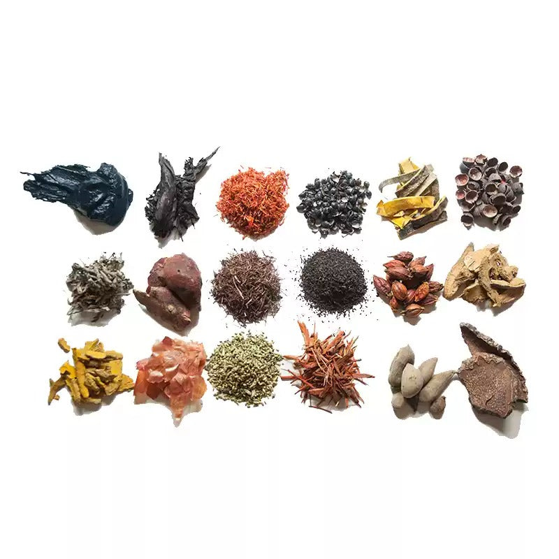 Natural dye materials arranged in orderly rows on a white background