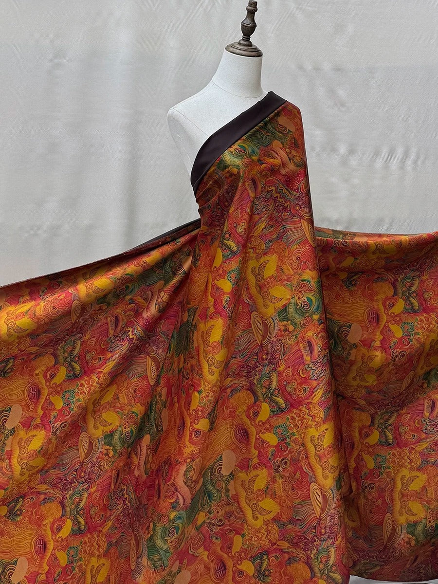 A mannequin wearing a vibrant, colorful dress with a patterned fabric draped over it.