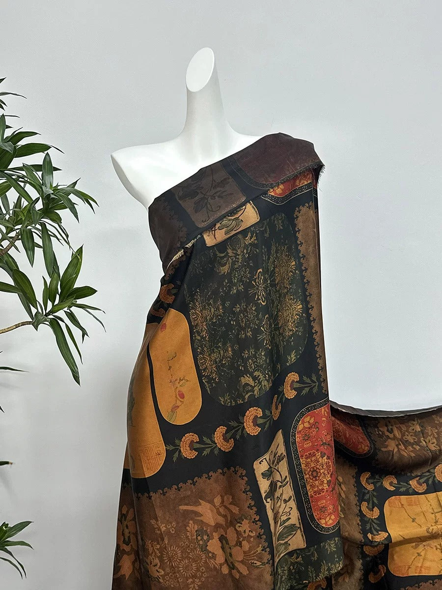 A mannequin wearing a colorful, patterned dress with a dark brown top and a black and gold design.