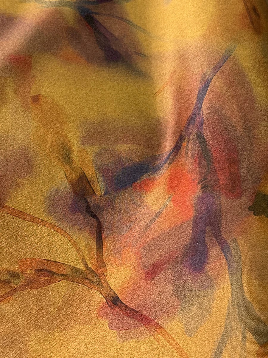 The image is an abstract painting with a mix of warm and cool colors, featuring brushstrokes and splatters that create a dynamic and expressive visual effect.