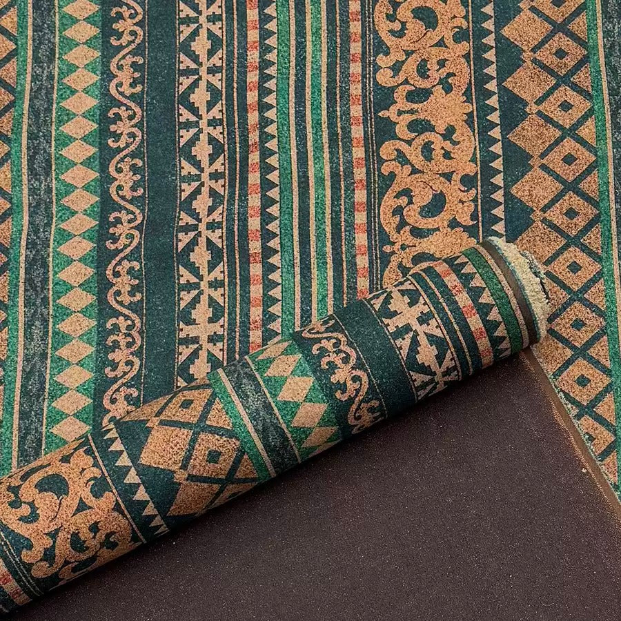 a close-up view of a colorful, patterned rug with a geometric design in shades of green, brown, and orange.