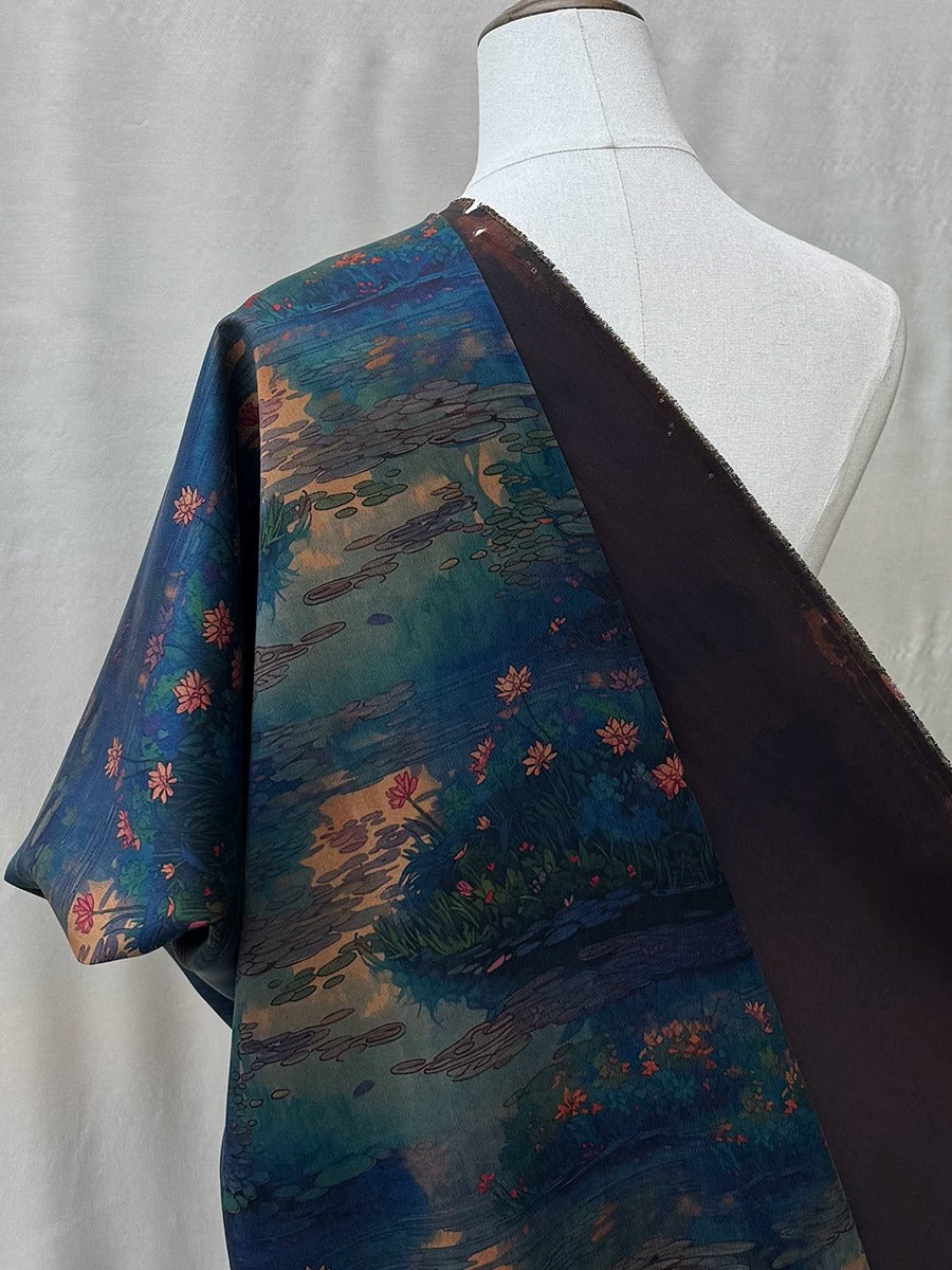 A mannequin wearing a colorful, patterned fabric with a floral design.
