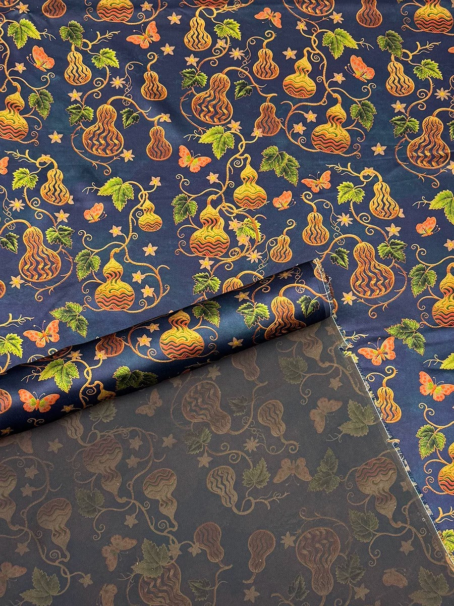 a vibrant and intricate pattern of gourds and leaves in shades of blue, orange, and green, creating a visually striking and detailed design.