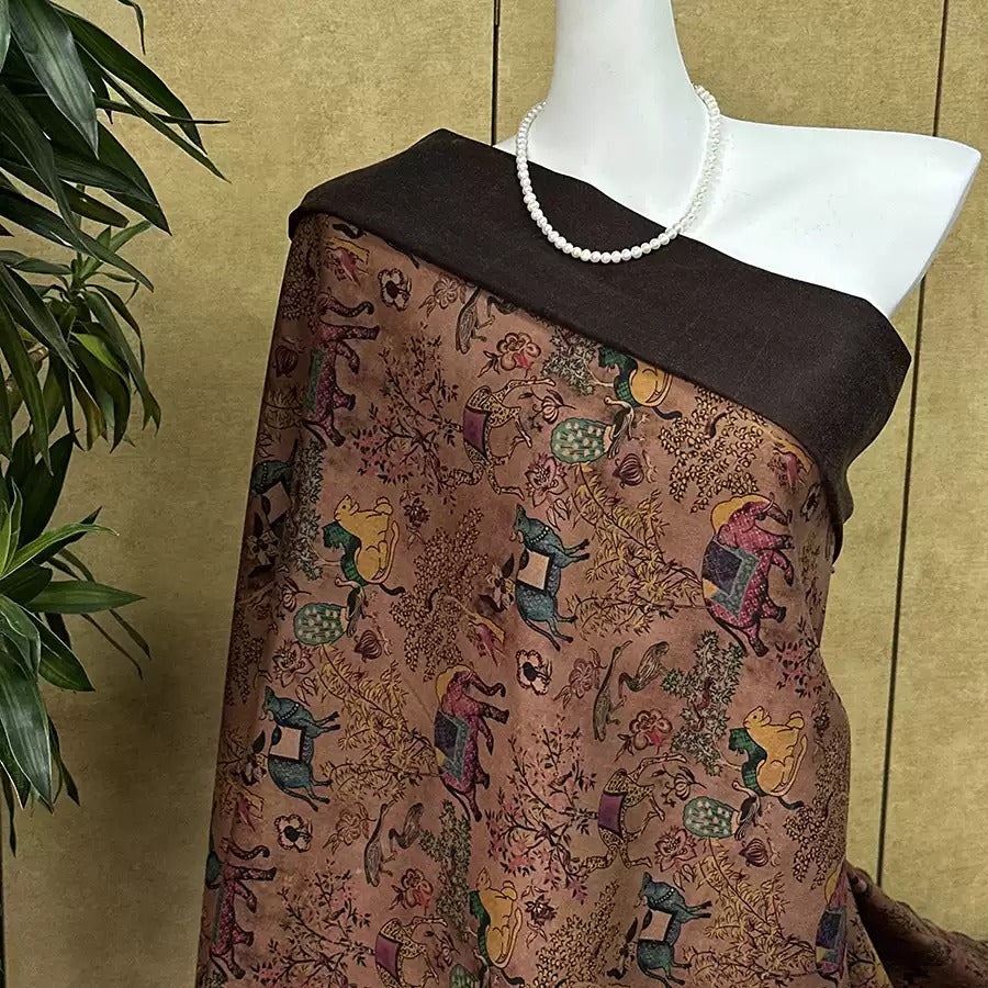 A mannequin wearing a brown and black patterned dress with a white pearl necklace.