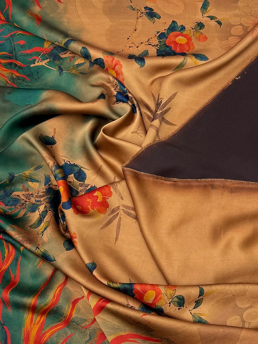 The image is a close-up view of a fabric with a floral pattern, featuring a mix of green, orange, and brown colors. The fabric appears to be made of silk or a similar material, and it has a crinkled texture.
