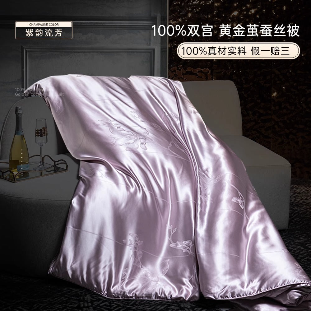 a bed covered in a satin purple blanket