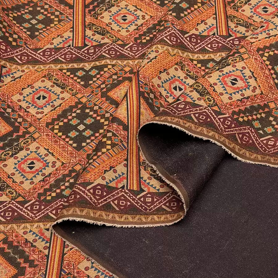 a close-up view of a colorful, intricately patterned fabric with a dark background.