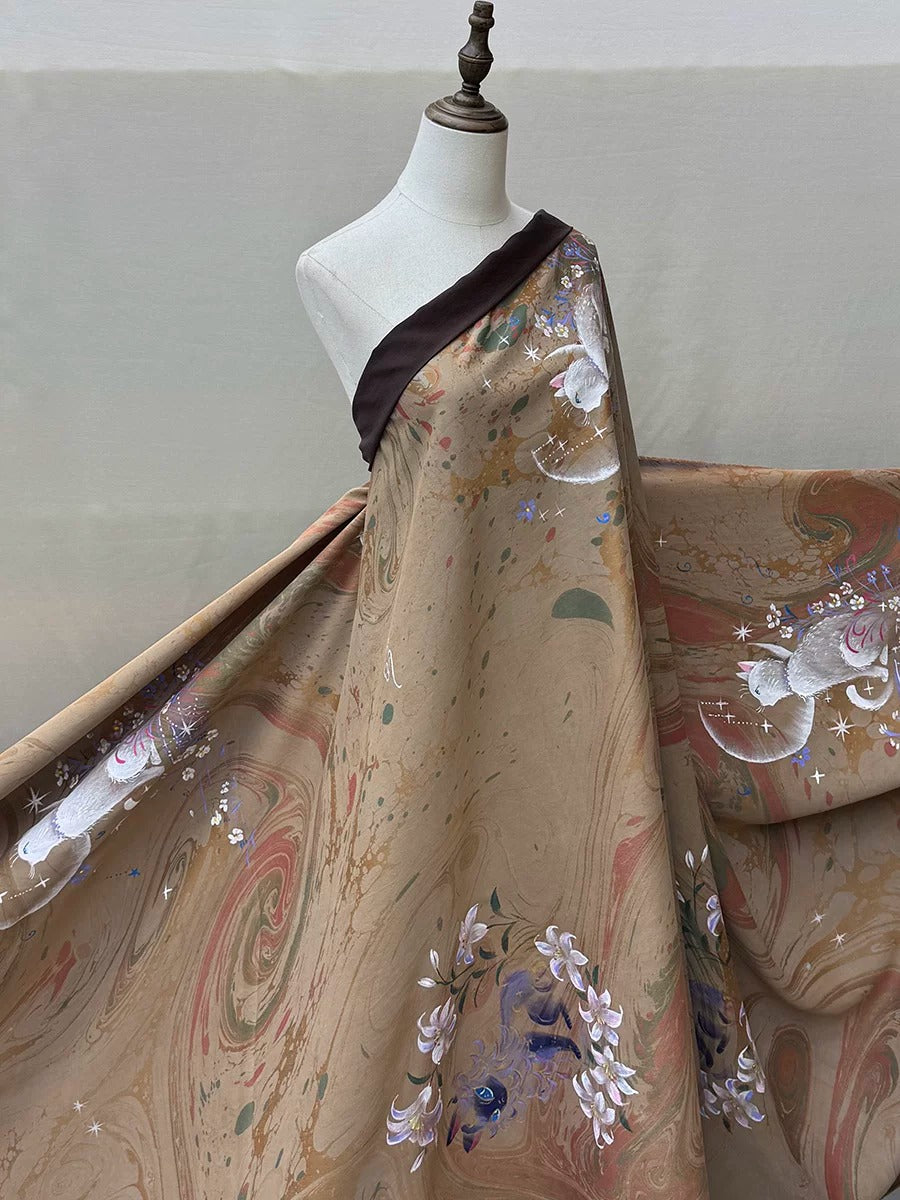 A mannequin wearing a large, flowing dress with a floral pattern.