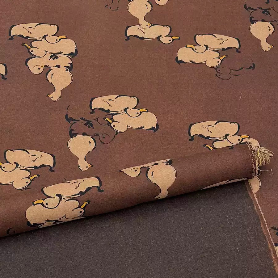 a close up of a fabric with elephants on it