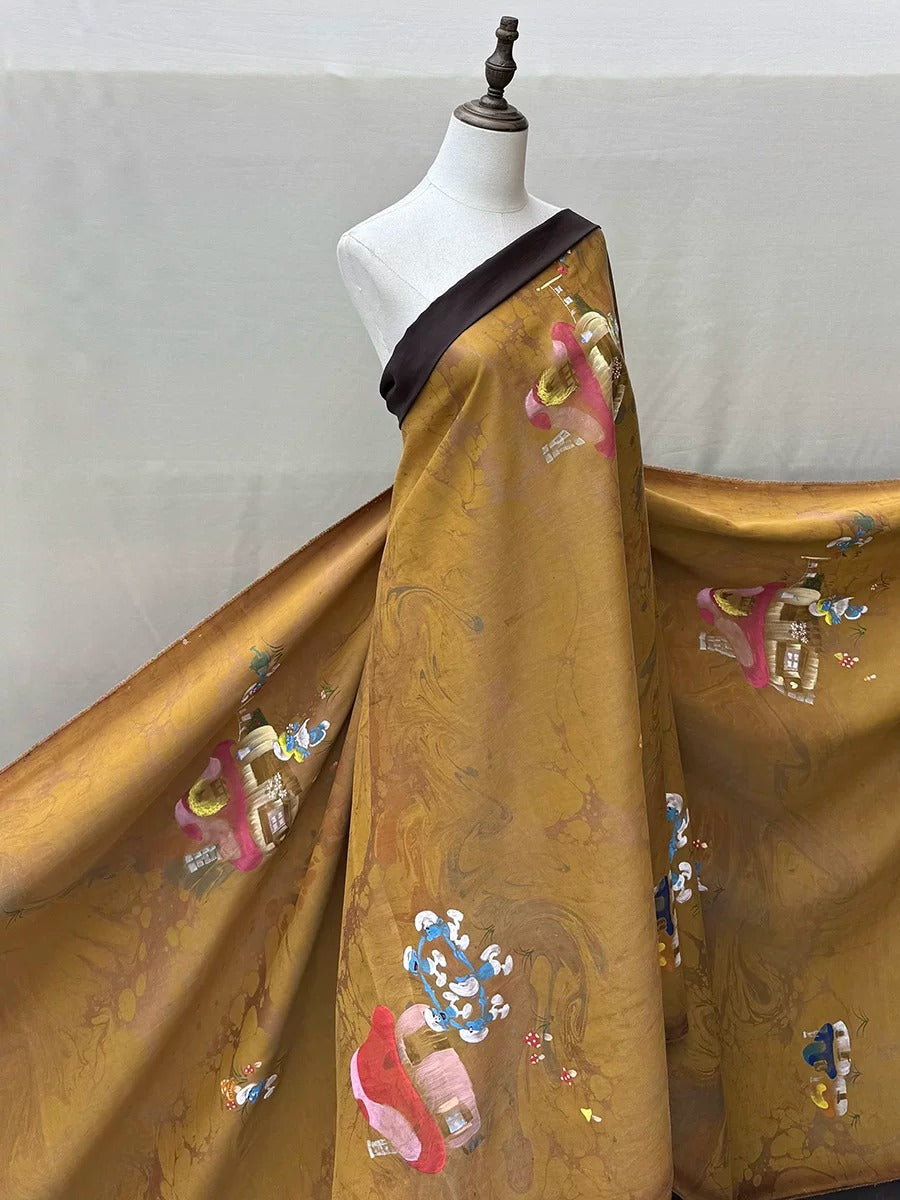 A mannequin wearing a gold-colored dress with a black strap and colorful floral patterns.