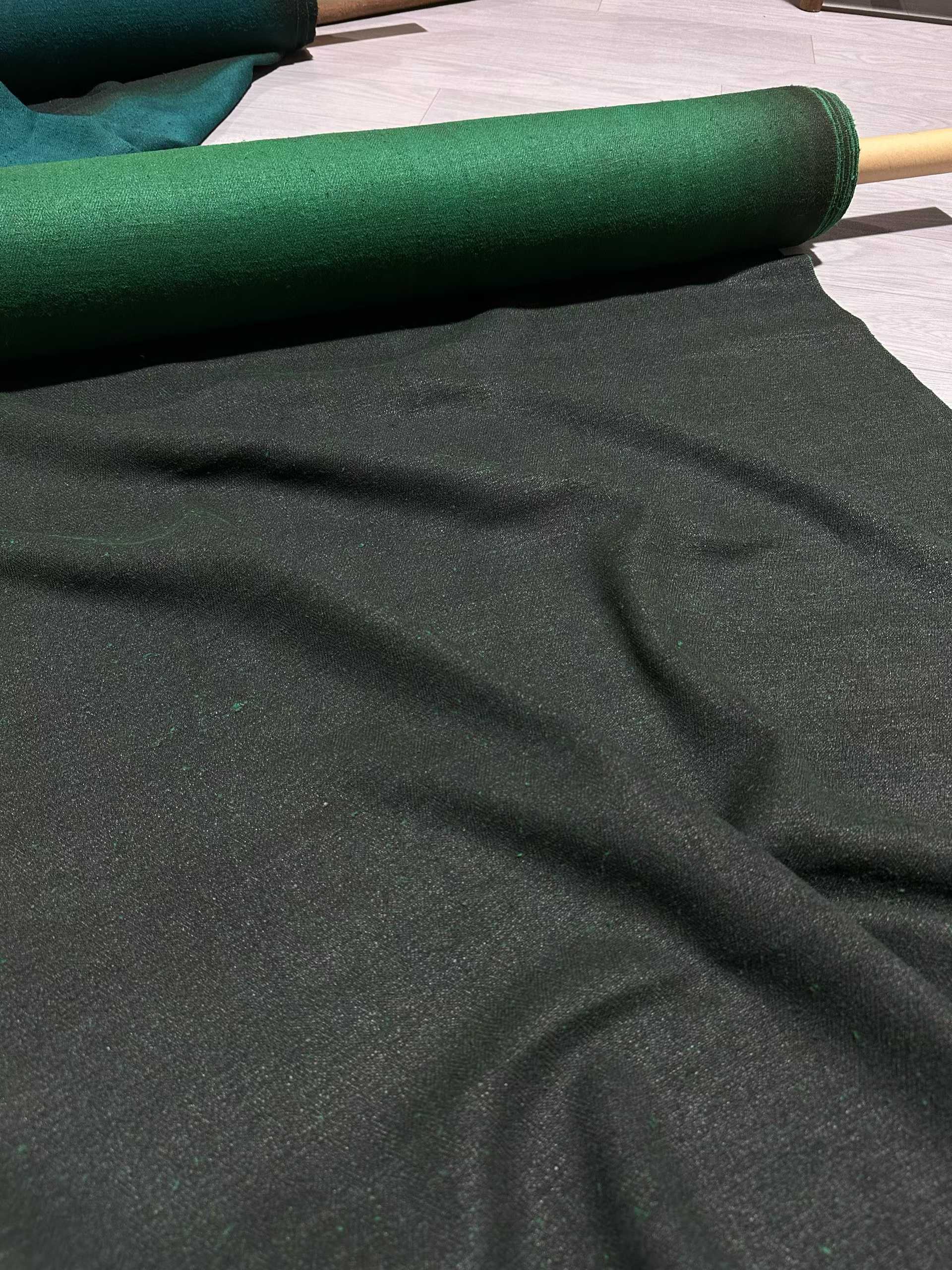 a close up of a piece of mud tussah silk #color_emerald