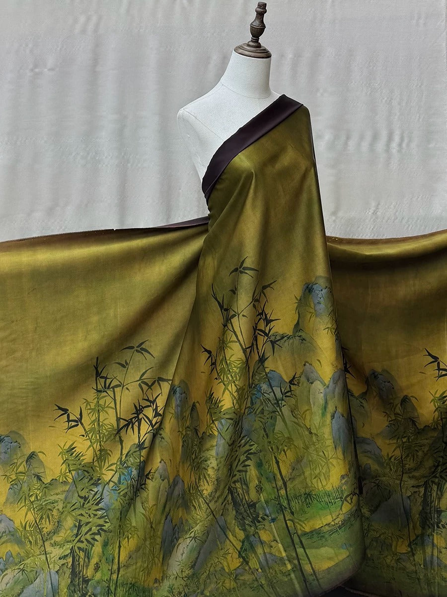 A mannequin wearing a green and gold dress with a bamboo-like pattern, displayed against a plain white background.