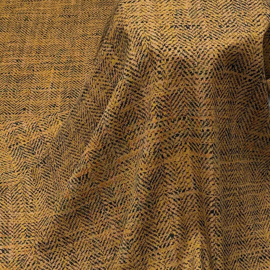 a close-up view of a fabric with a herringbone pattern, featuring a mix of black and yellow colors.