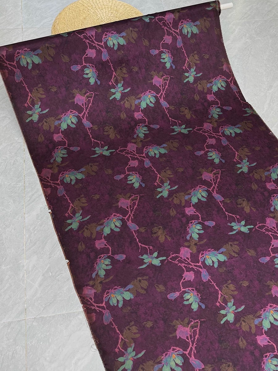 a vibrant purple floral pattern with green leaves and flowers, creating a visually striking and colorful design.