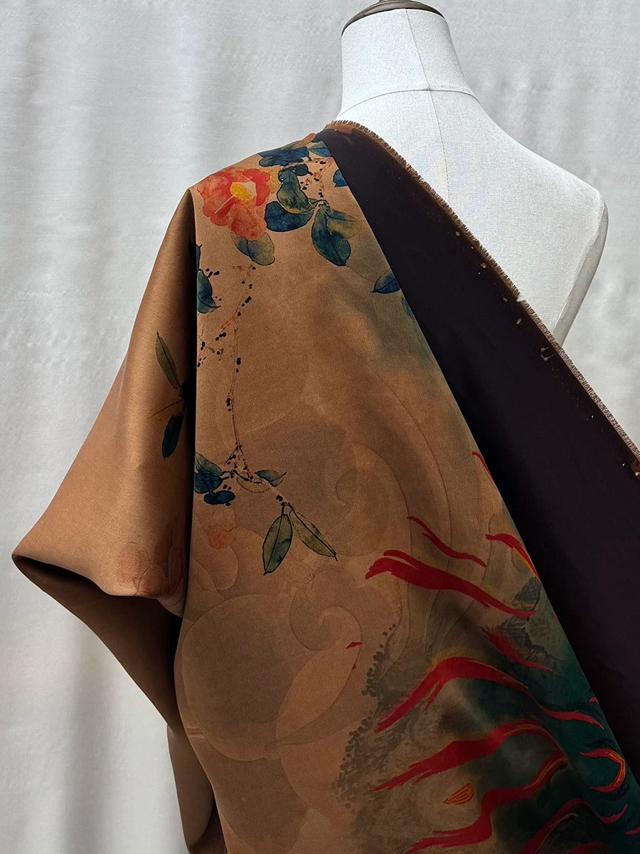a mannequin wearing a colorful, patterned fabric draped over its shoulder.