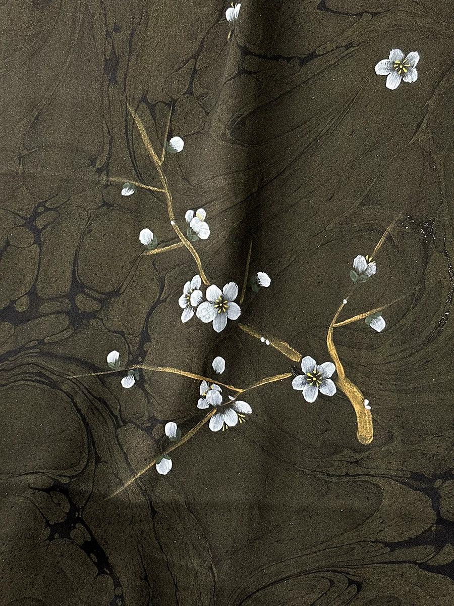 delicate white flowers on a dark brown background, creating a serene and elegant composition.