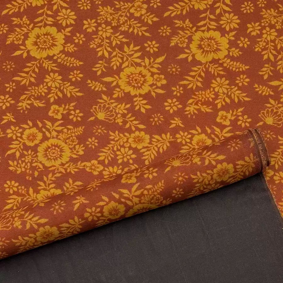 a close up of a fabric with a flower pattern