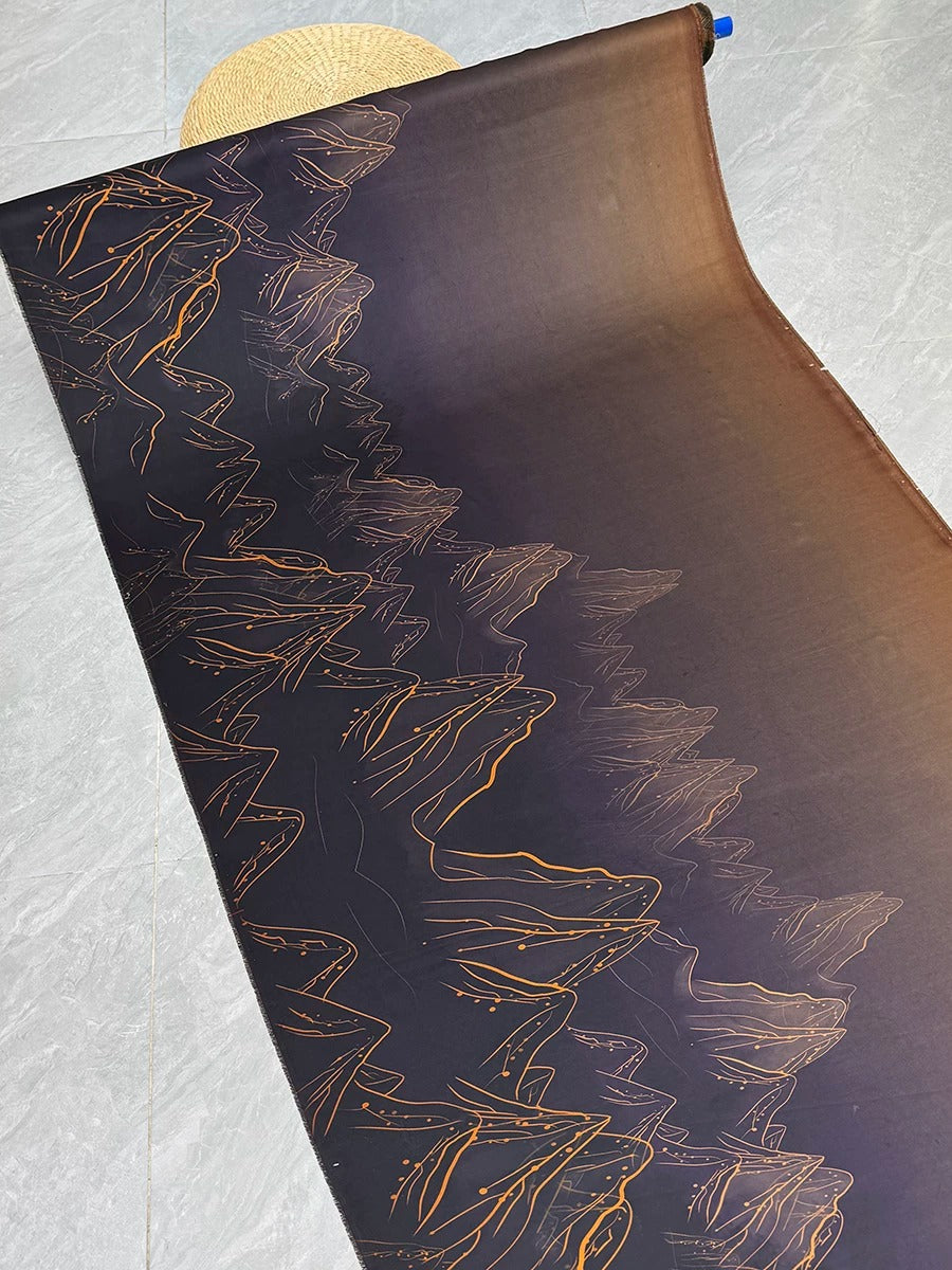 a dark purple fabric with a repeating pattern of orange and black lines, resembling a mountain range or landscape design.