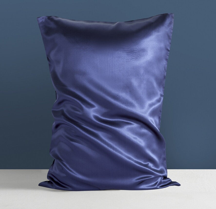 a pillow with a blue satin covering it