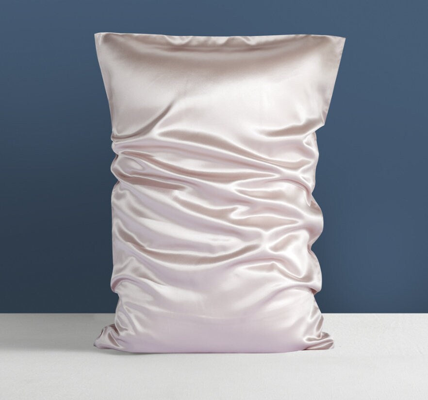 a white pillow with a ruffled design on it