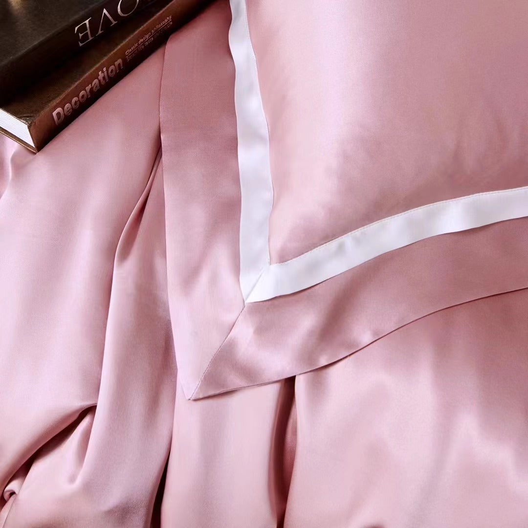 a pink bed with a book on top of it